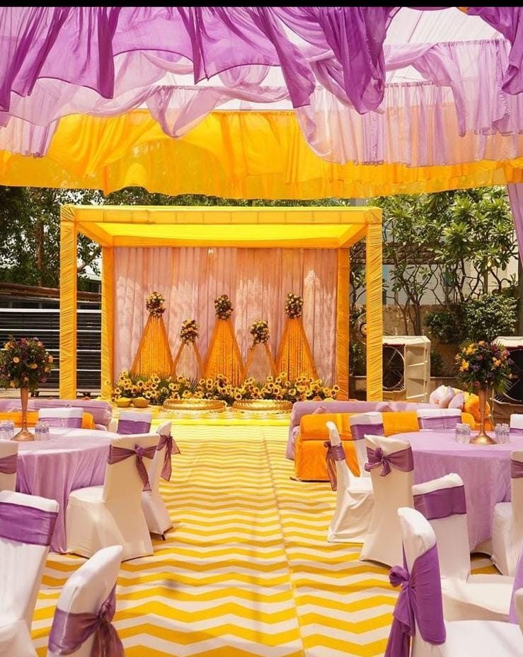 Haldi mandap and seating dΓ©cor by Negi Catering