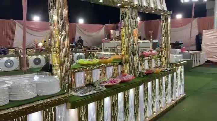 Evening buffet with lit counters set up by Negi Catering